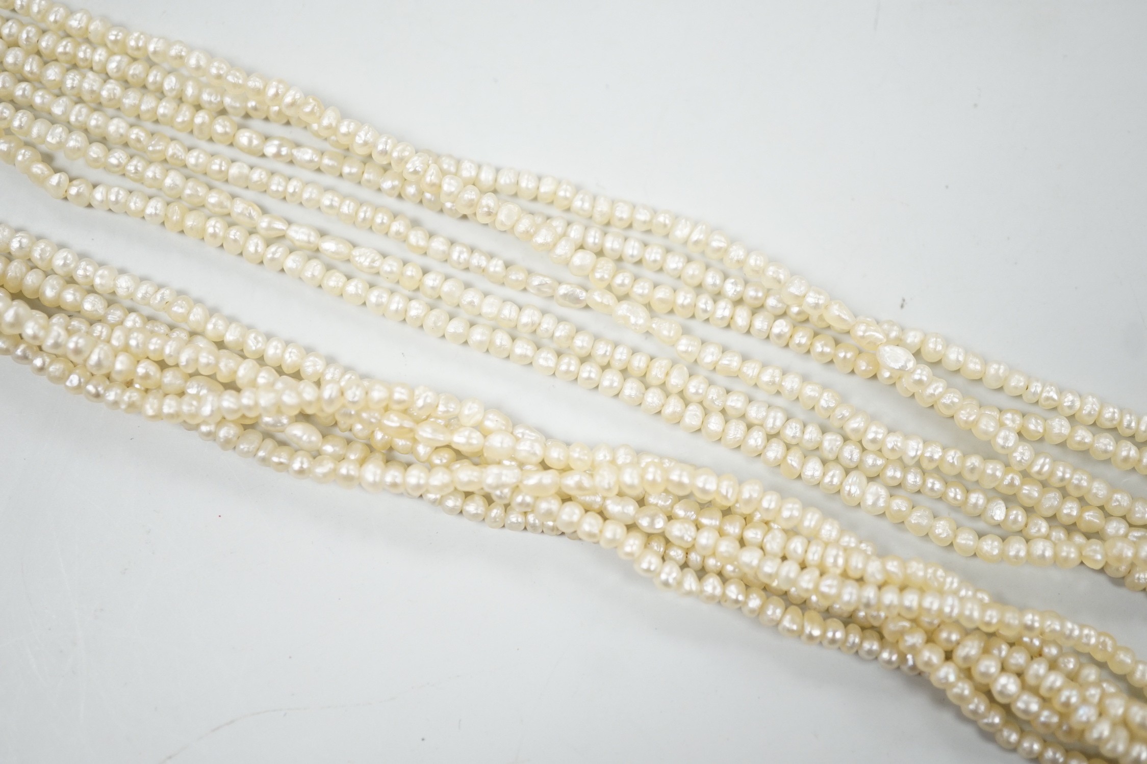 A 1960's Cropp & Farr multi strand seed pearl necklace, with 9ct gold, citrine and split pearl set clasp, 46cm.